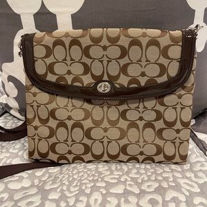 Barely used Coach iPad or laptop bag. Can function as crossbody too.
